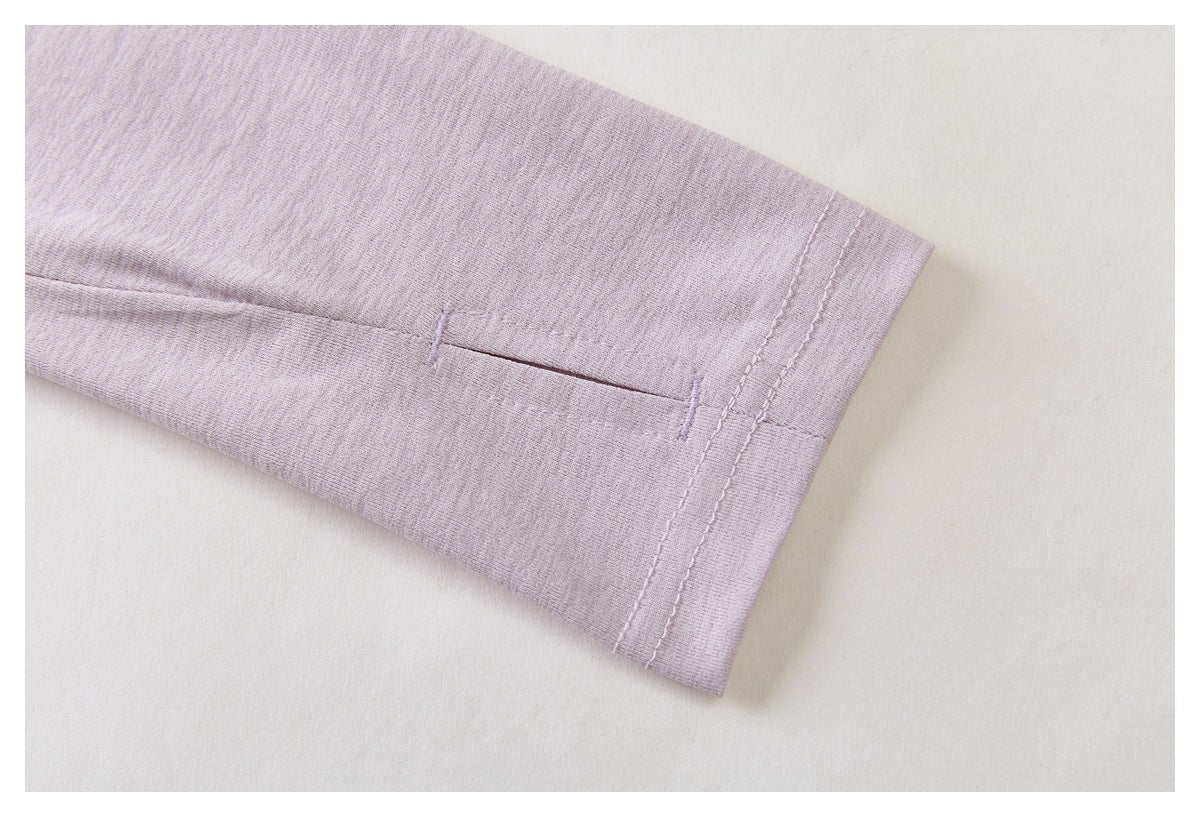 Pale lavender sleeve cuff with a small slit and parallel rows of stitching.