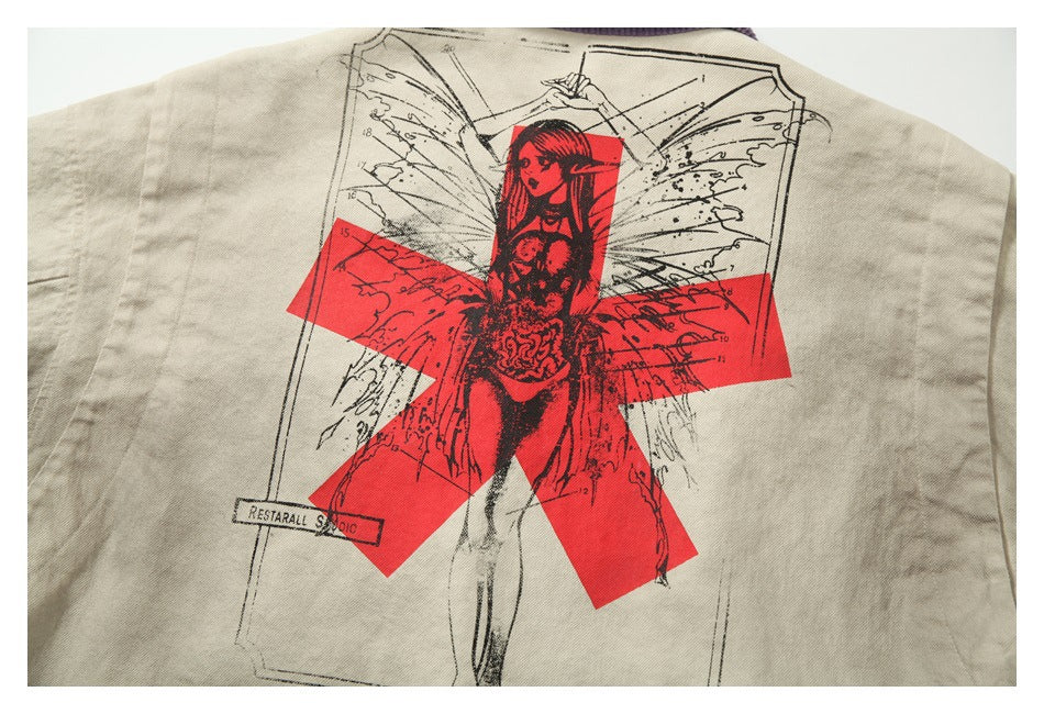 Close-up of a beige jacket back graphic with a red cross-like shape, black illustration and small printed text.