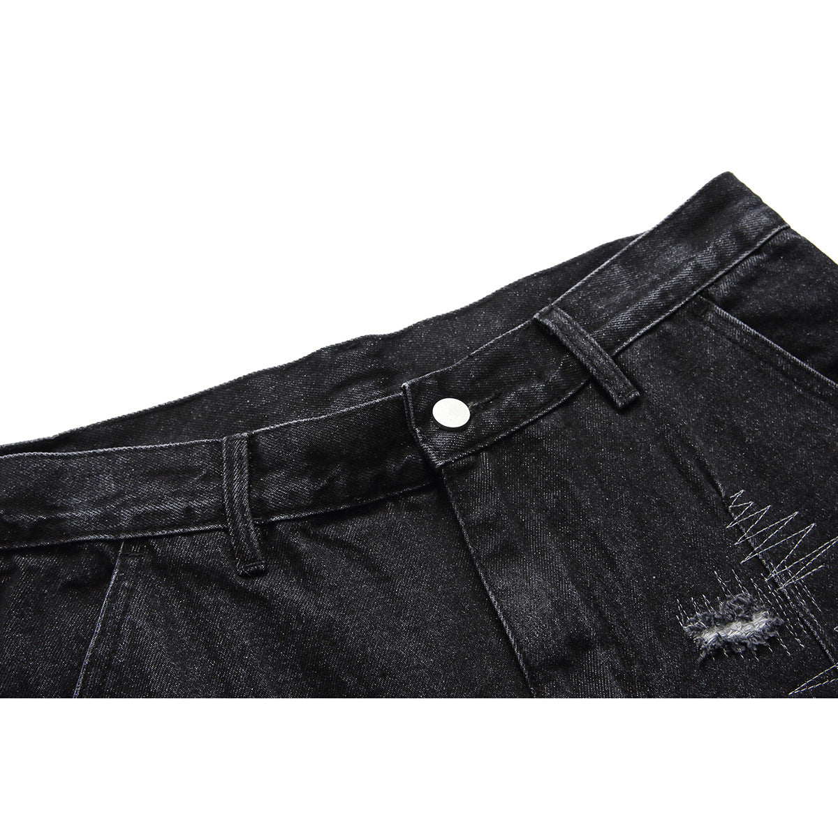 Close-up of black denim shorts waistband, button, belt loops, and distressed stitching.