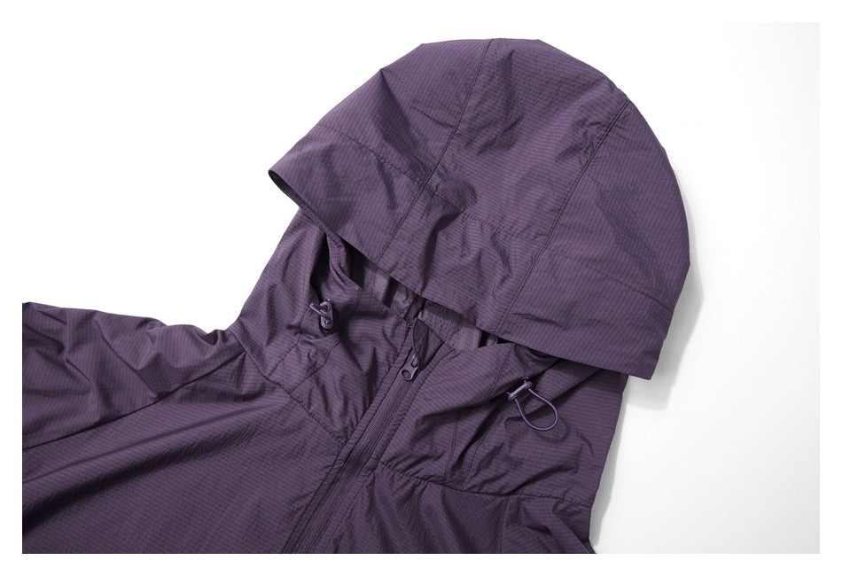 Close-up of a purple hooded jacket showing the hood, front zipper, drawcords, and upper chest.