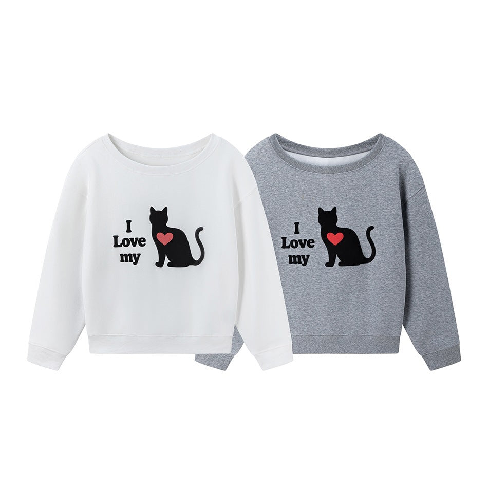 White and heather-gray crewneck sweatshirts displayed front-facing, each with a black cat and red heart graphic.