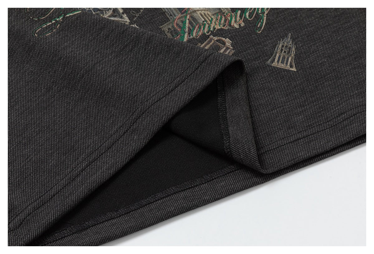Close-up of dark printed fabric folded to reveal the hem and underside stitching.