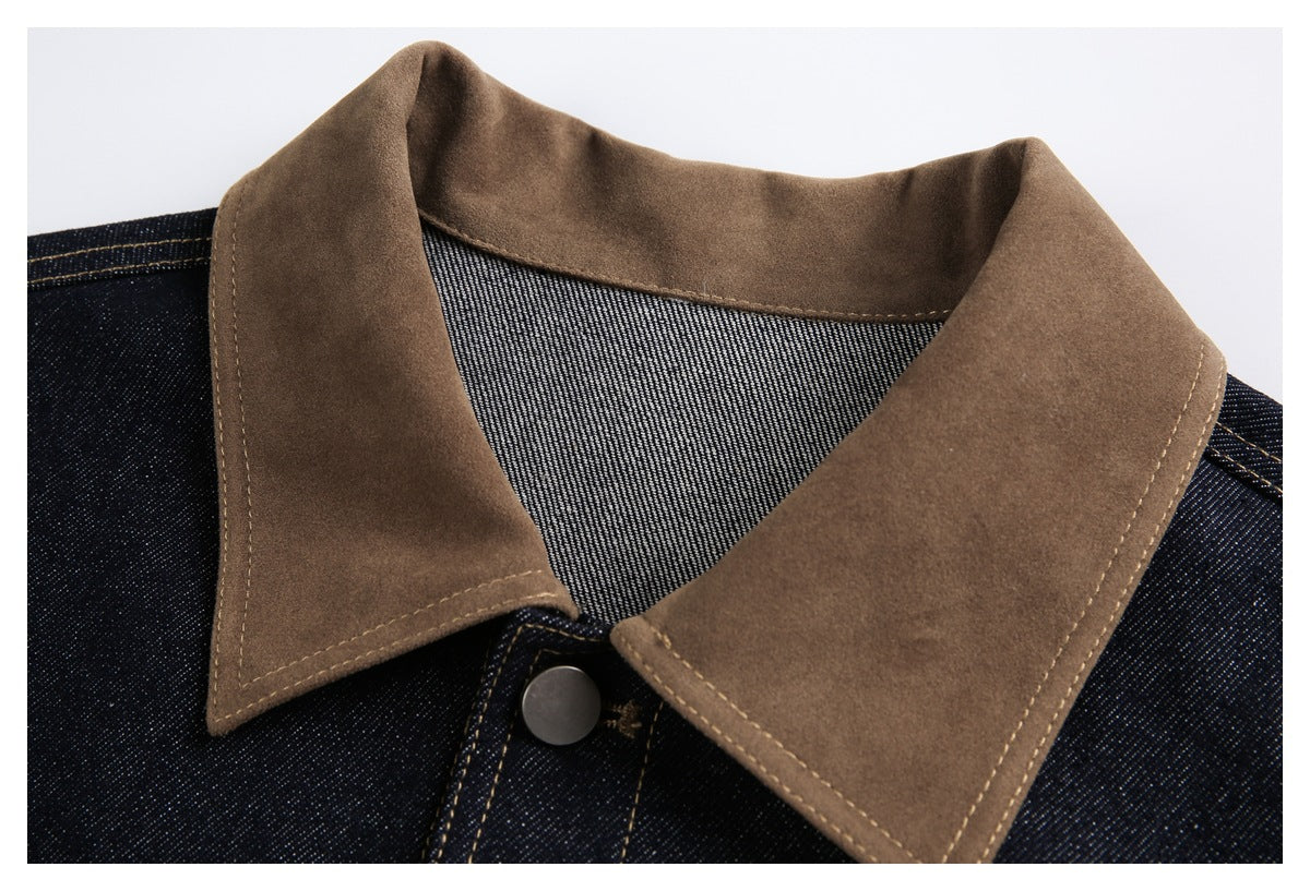 Close-up of the jacket’s brown collar, dark denim, contrast stitching and top metal button.