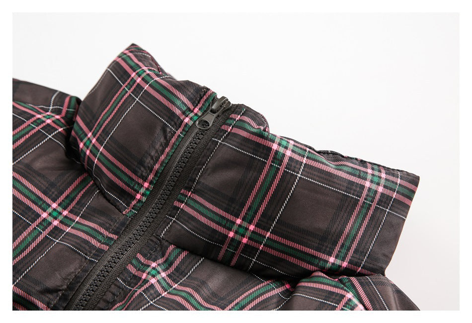 Close-up of the plaid jacket's raised collar and black front zipper.