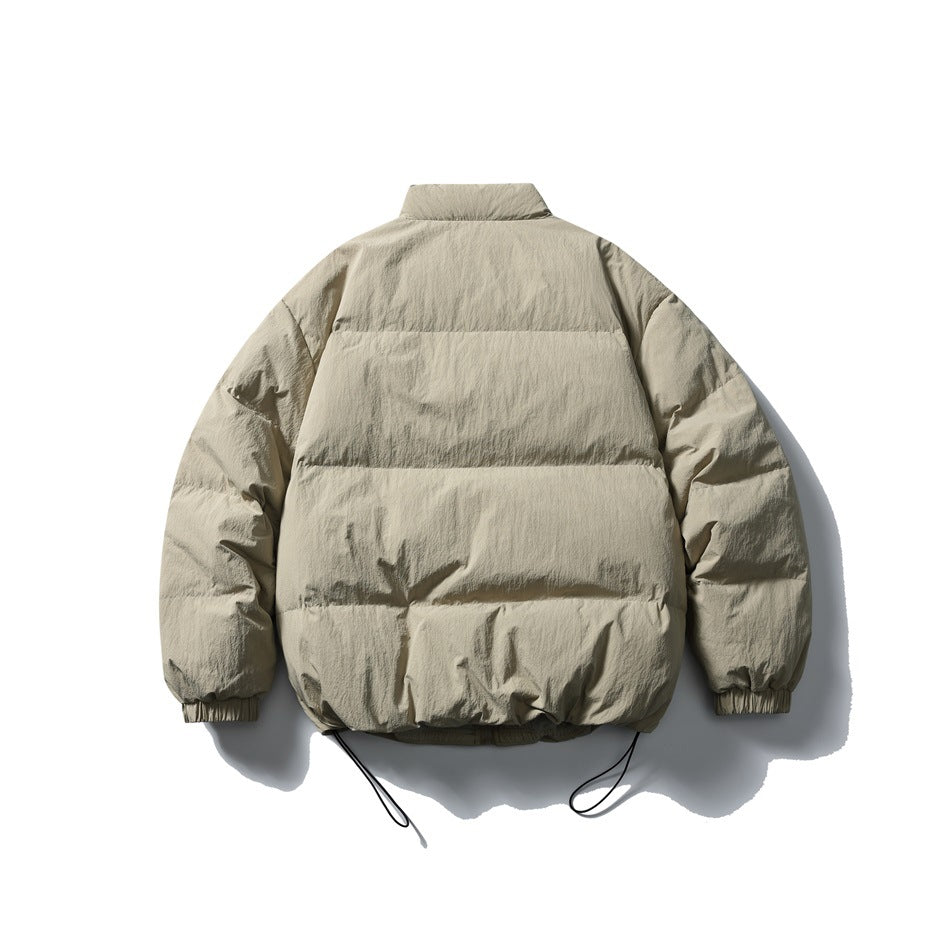 Back view of khaki puffer jacket with horizontal quilted baffles, stand collar, elastic cuffs and drawcord hem