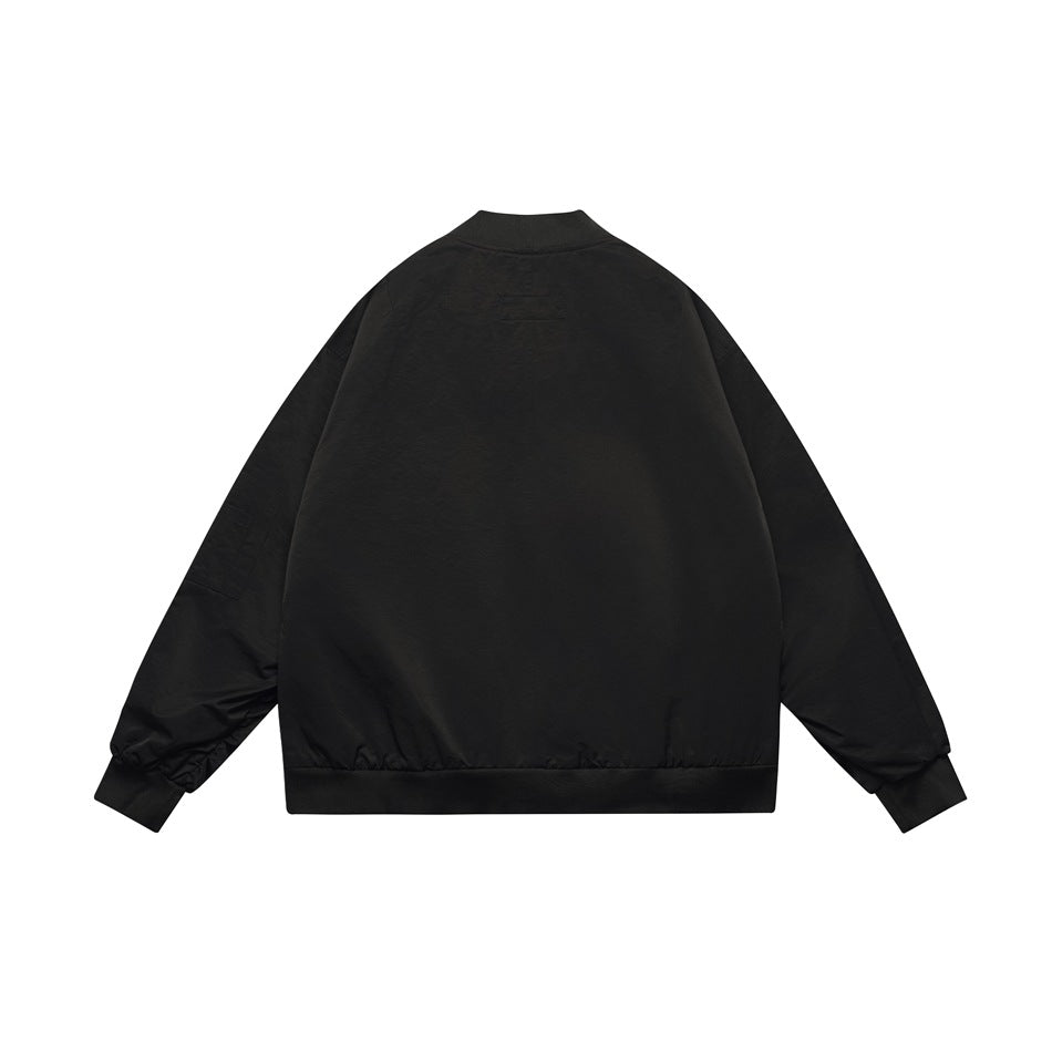 Back view of a plain black bomber jacket with a ribbed collar, cuffs and hem.