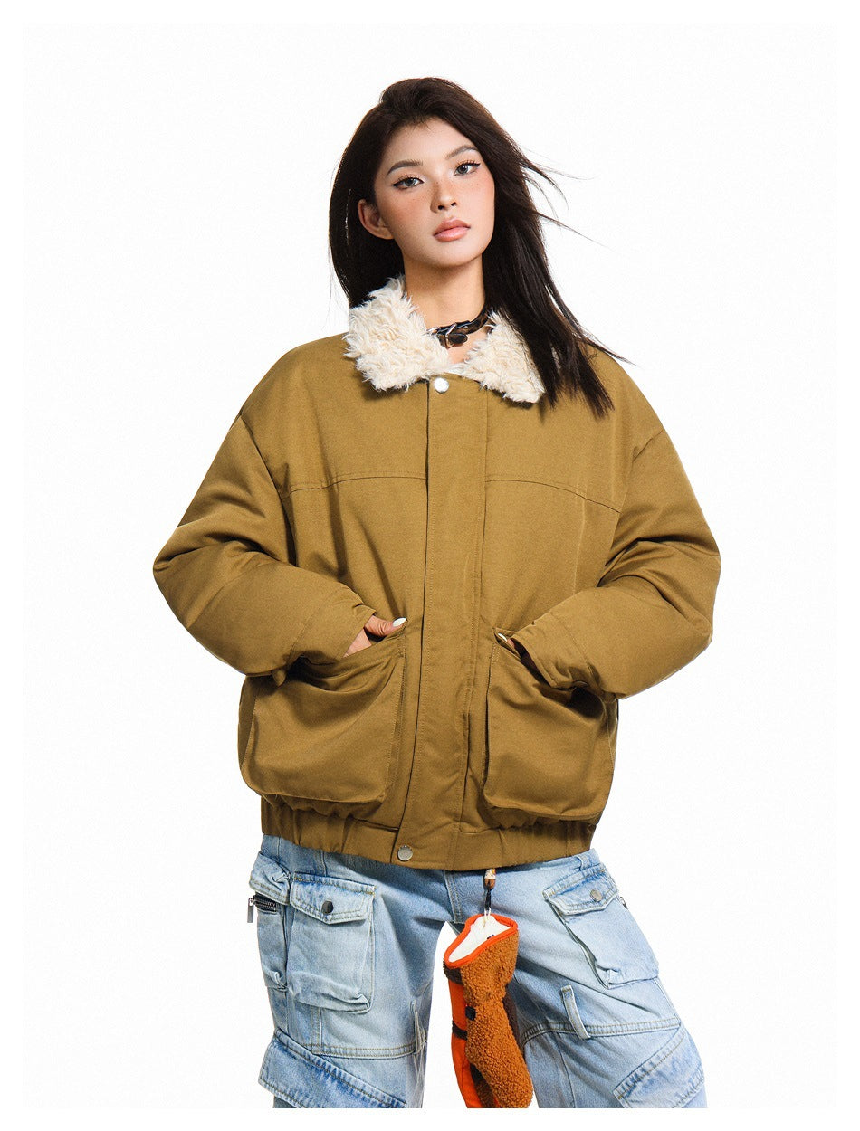 Model wearing a mustard-brown jacket with a cream fleece collar, front pockets and snap closures.