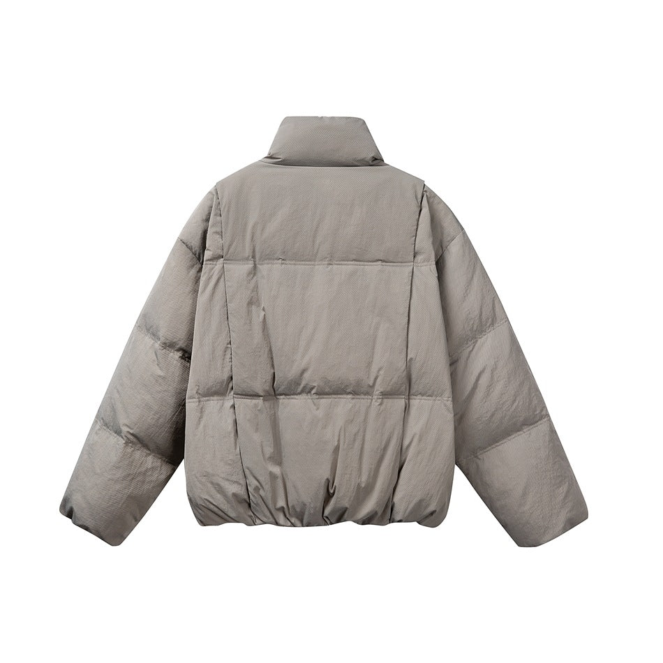 Back view of a taupe-gray puffer jacket with a high collar and horizontal quilted panels, shown flat against white.