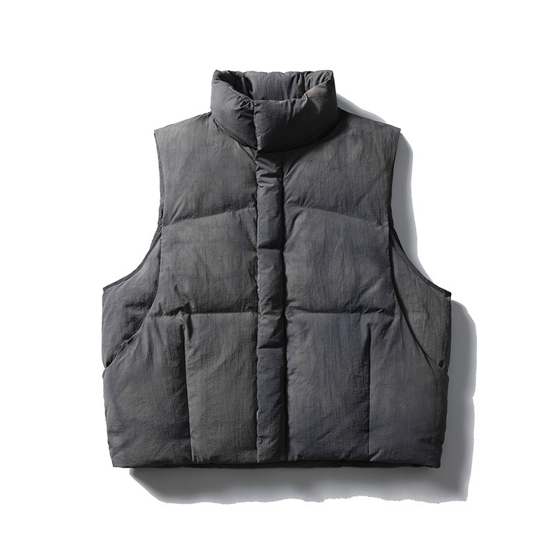 Graphite gray sleeveless quilted puffer vest with stand collar and center placket, flat lay