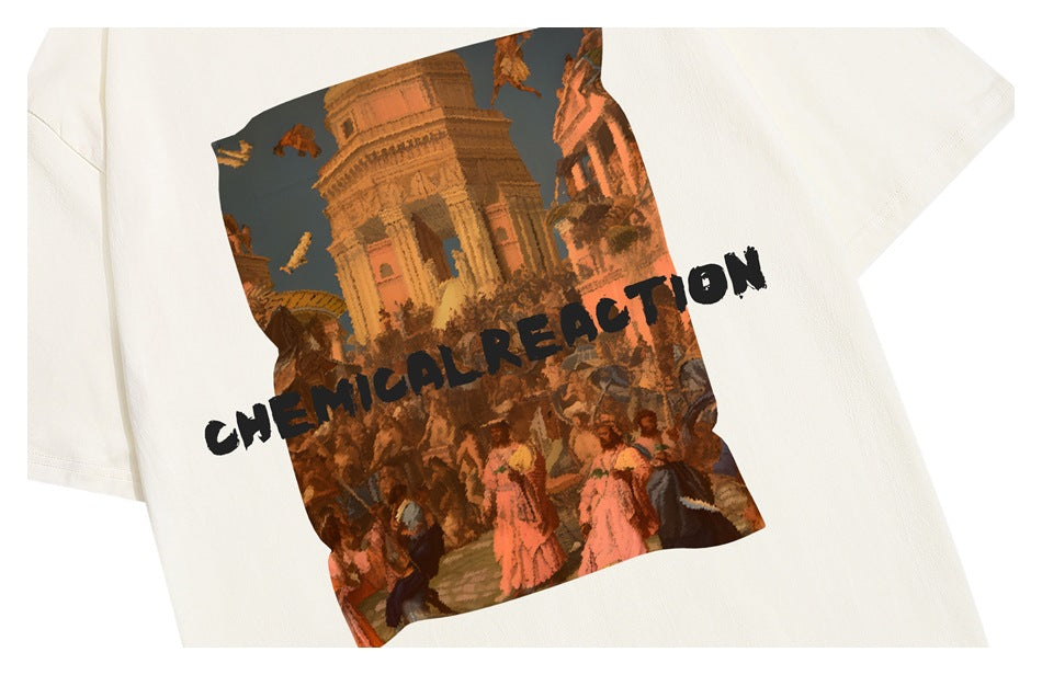Close-up of an ivory T-shirt's colorful crowd and historic architecture graphic with black CHEMICAL REACTION lettering.