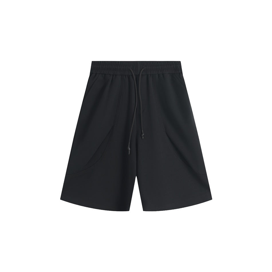 Black knee-length shorts with elastic drawstring waist, curved front seams and side pockets, flat lay front view