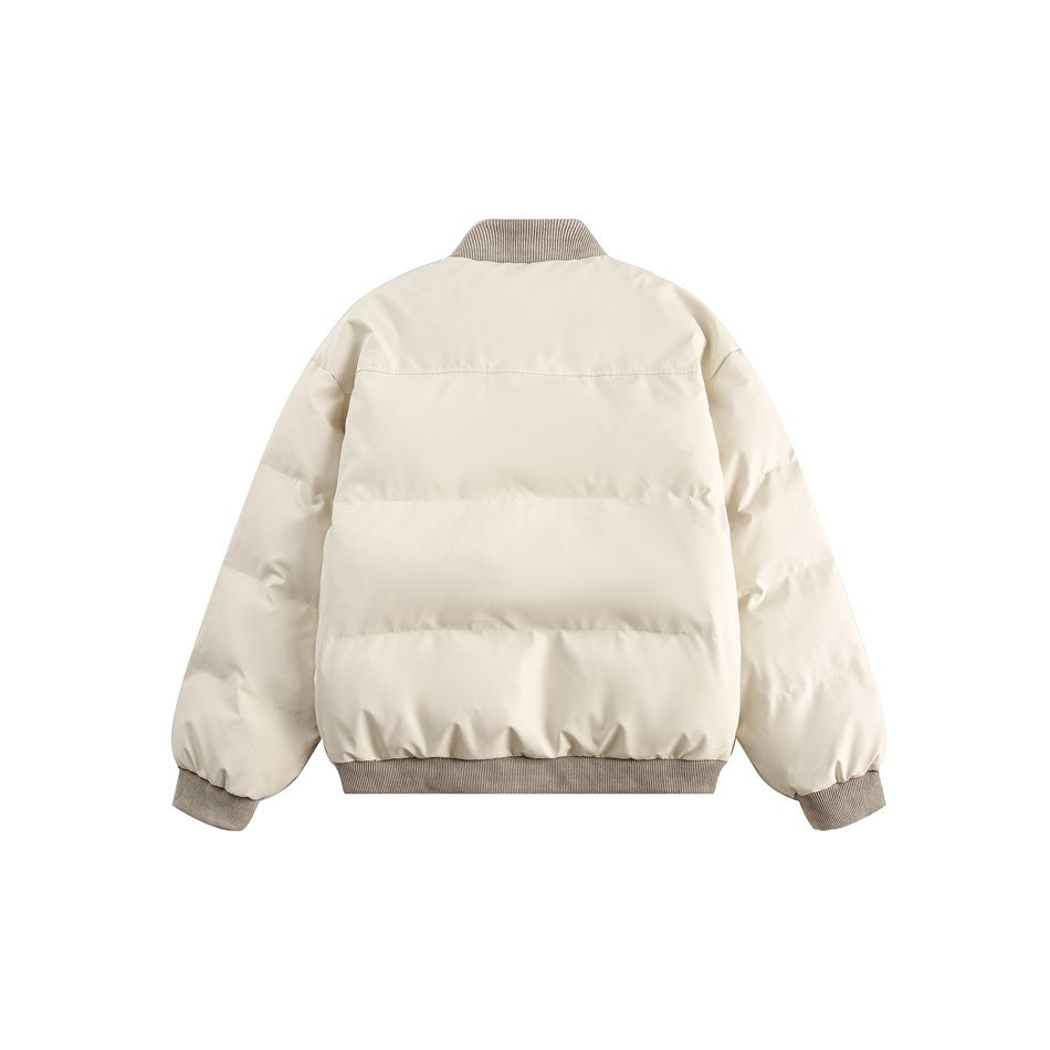 Back view of an ivory quilted jacket with horizontal seams and a ribbed taupe collar, hem, and cuffs.