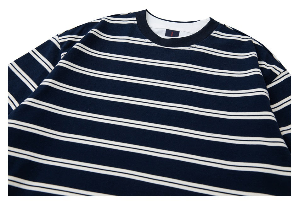 Close-up of the navy-and-white striped shirt’s front neckline and upper chest.