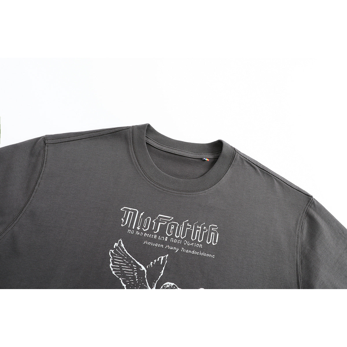 Close-up of a charcoal gray crew-neck T-shirt with a white graphic print across the chest.