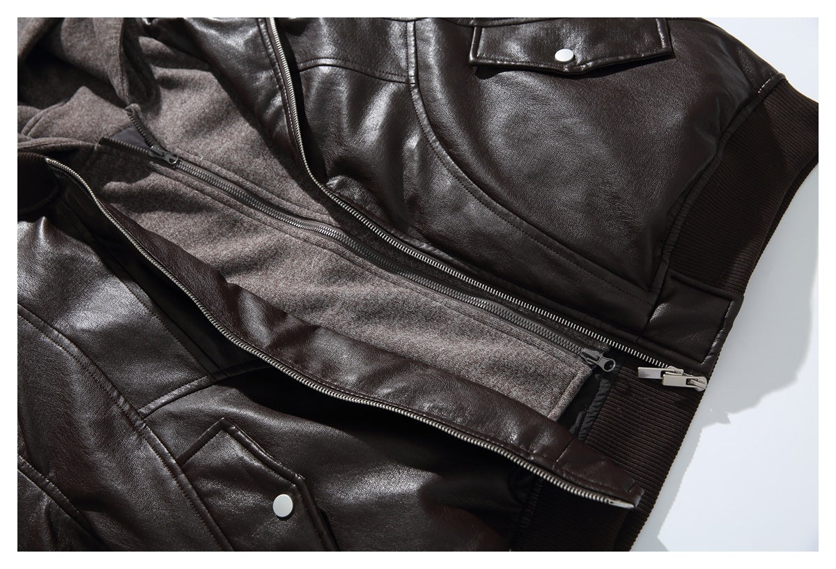 Close-up of the dark brown hooded jacket opened to show its gray-brown zip layer, snap pockets, and ribbed hem.