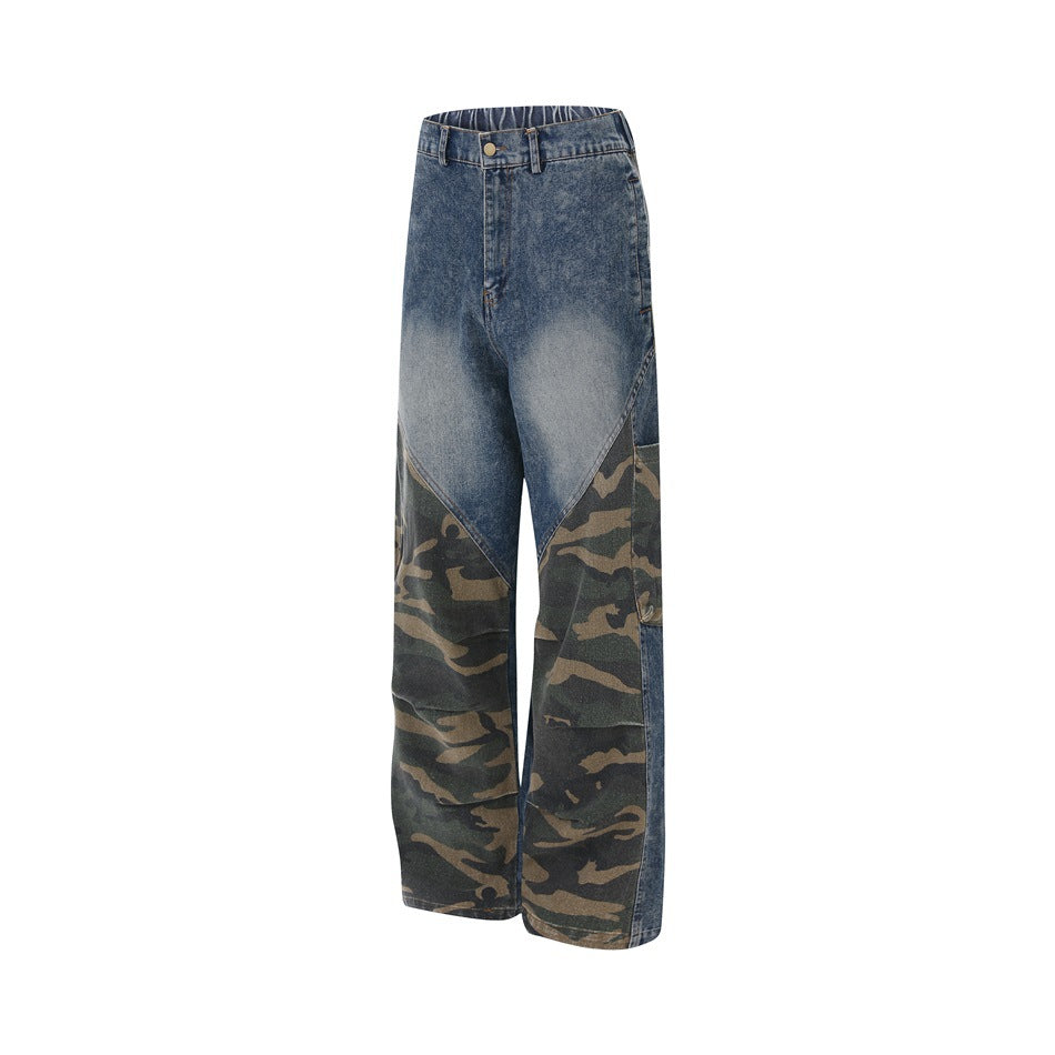 Angled front view of wide-leg faded blue jeans with camouflage lower-leg panels.