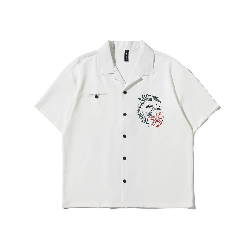 White short-sleeve camp-collar button shirt with chest pocket and wreath and starfish print, flat front view