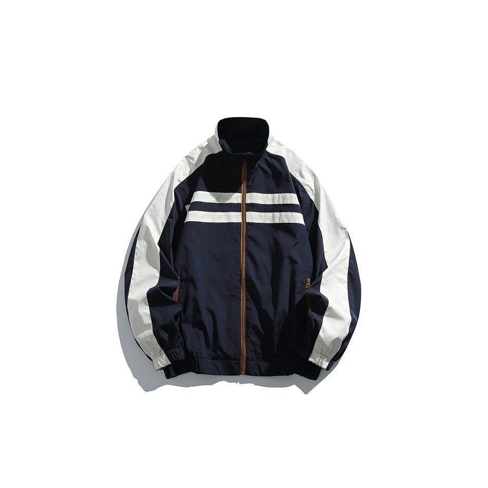 Navy and off-white color-block stand-collar zip jacket with brown zipper, flat front view