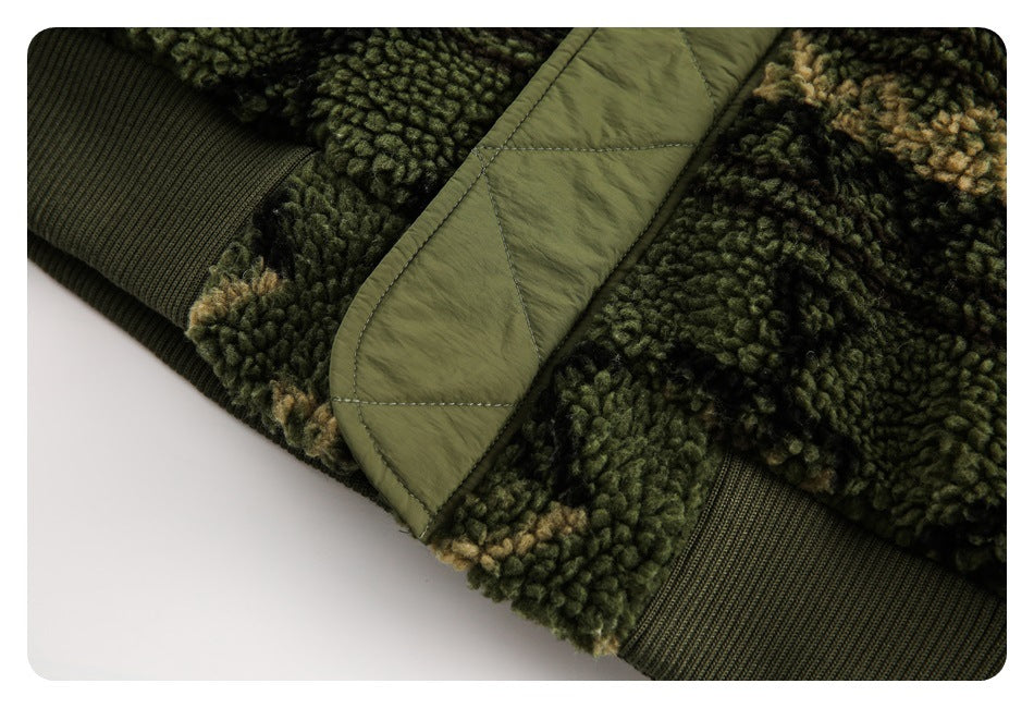 Close-up of a dark green and tan fuzzy jacket with an olive quilted flap and ribbed cuff.
