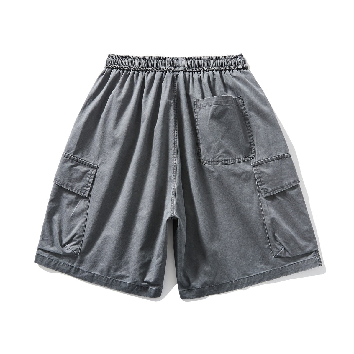 Back view of charcoal gray wide-leg cargo shorts with an elastic waistband, rear pocket, and large side cargo pockets.