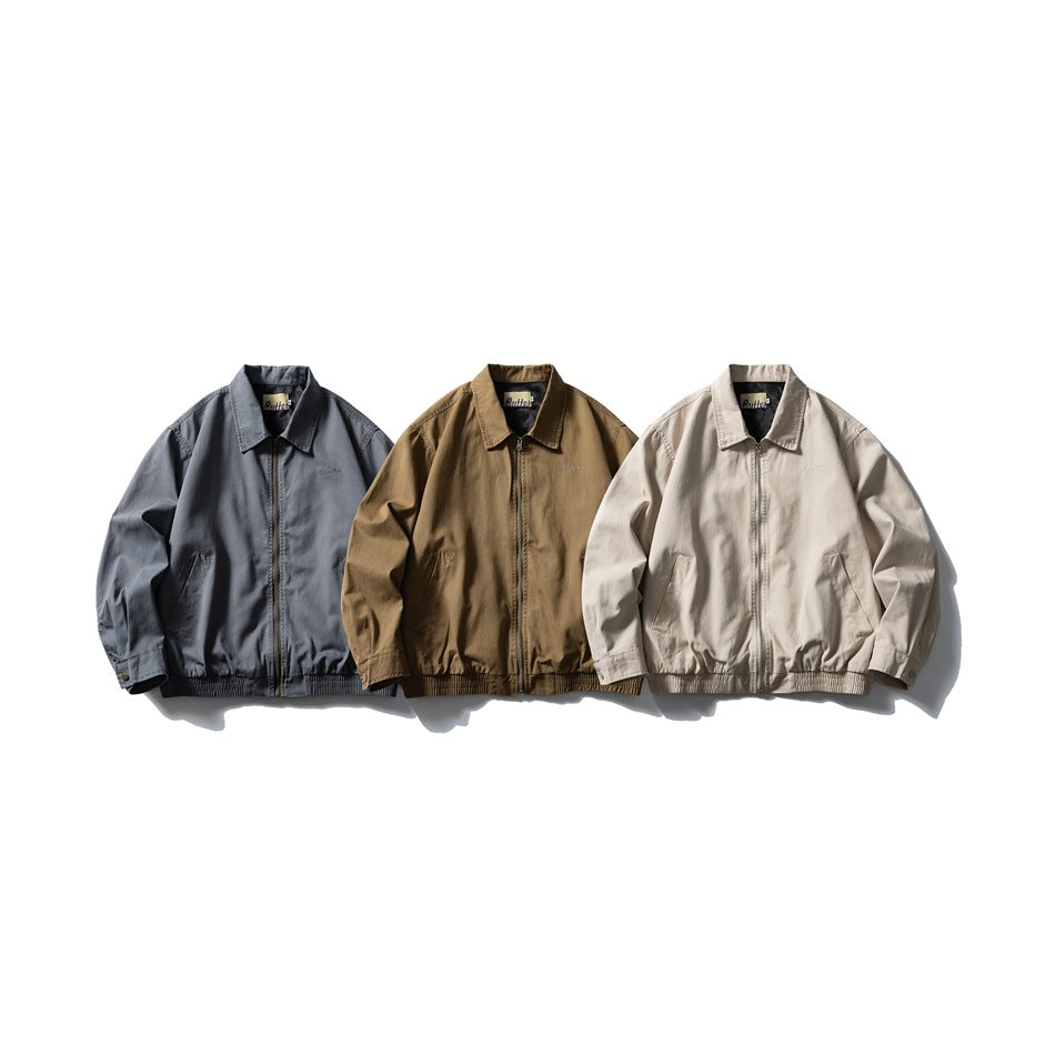 Three zip-front jackets arranged side by side in slate blue, brown and light beige.