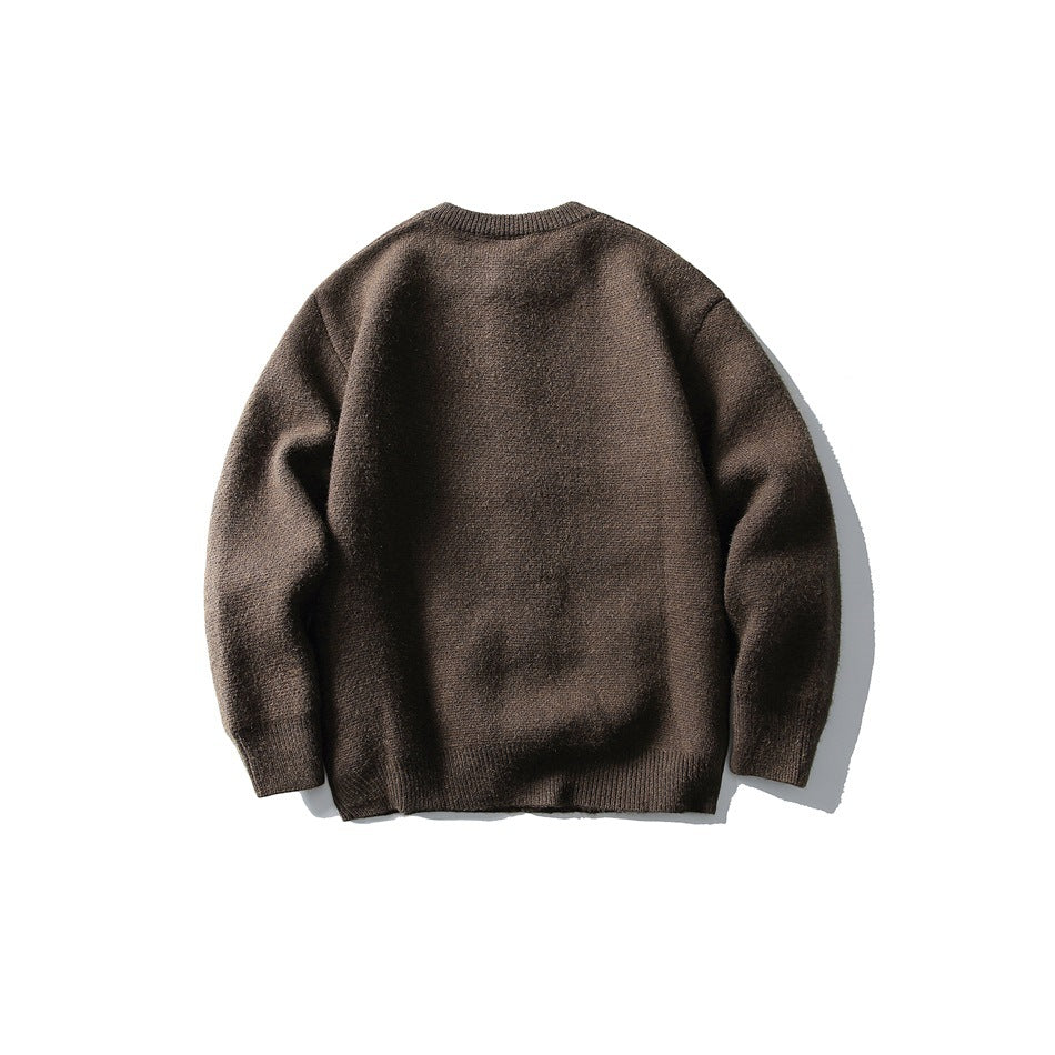 Back view of a brown long-sleeve knit sweater with a round neckline and ribbed cuffs and hem.