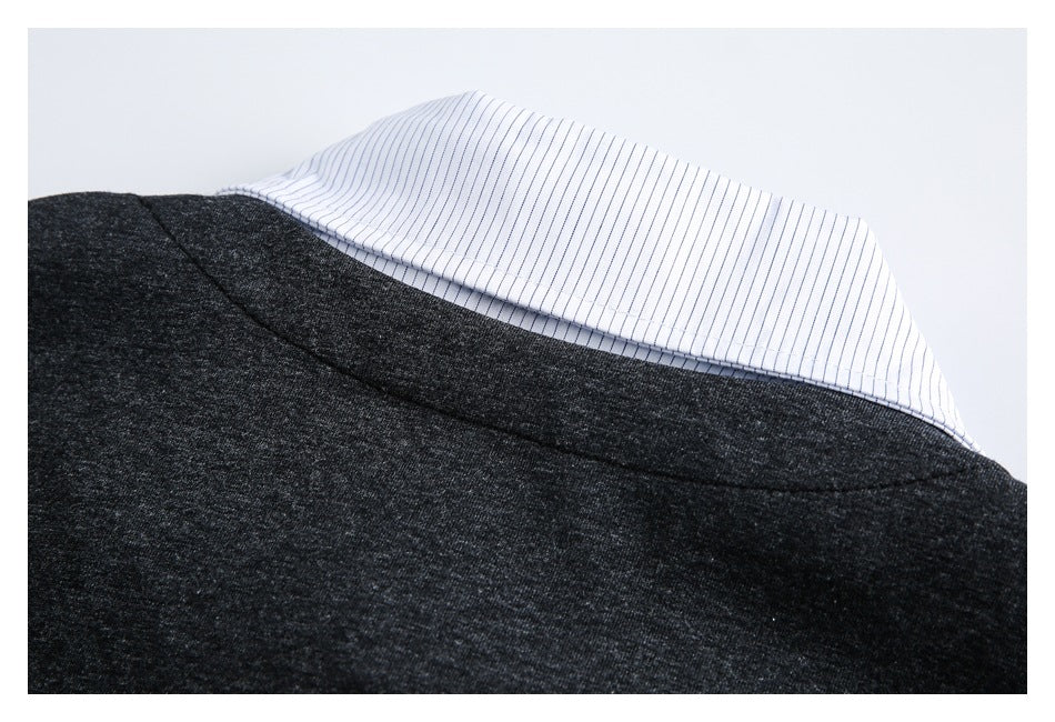 Back neckline detail of a charcoal heather garment with a white pinstriped collar.