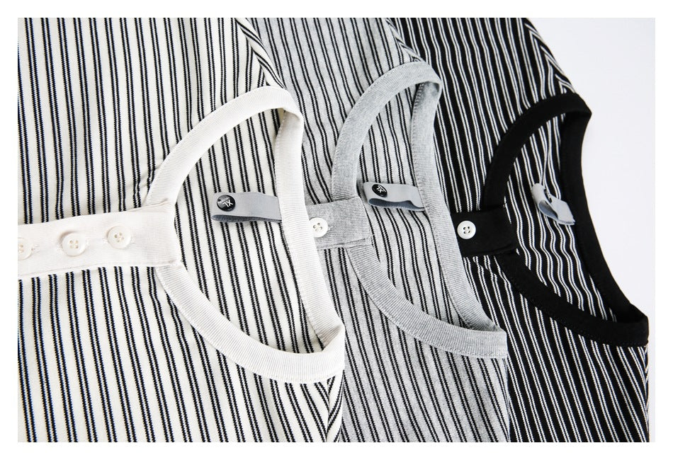 Close-up of striped shirt necklines and button plackets in white, gray, and black colorways.