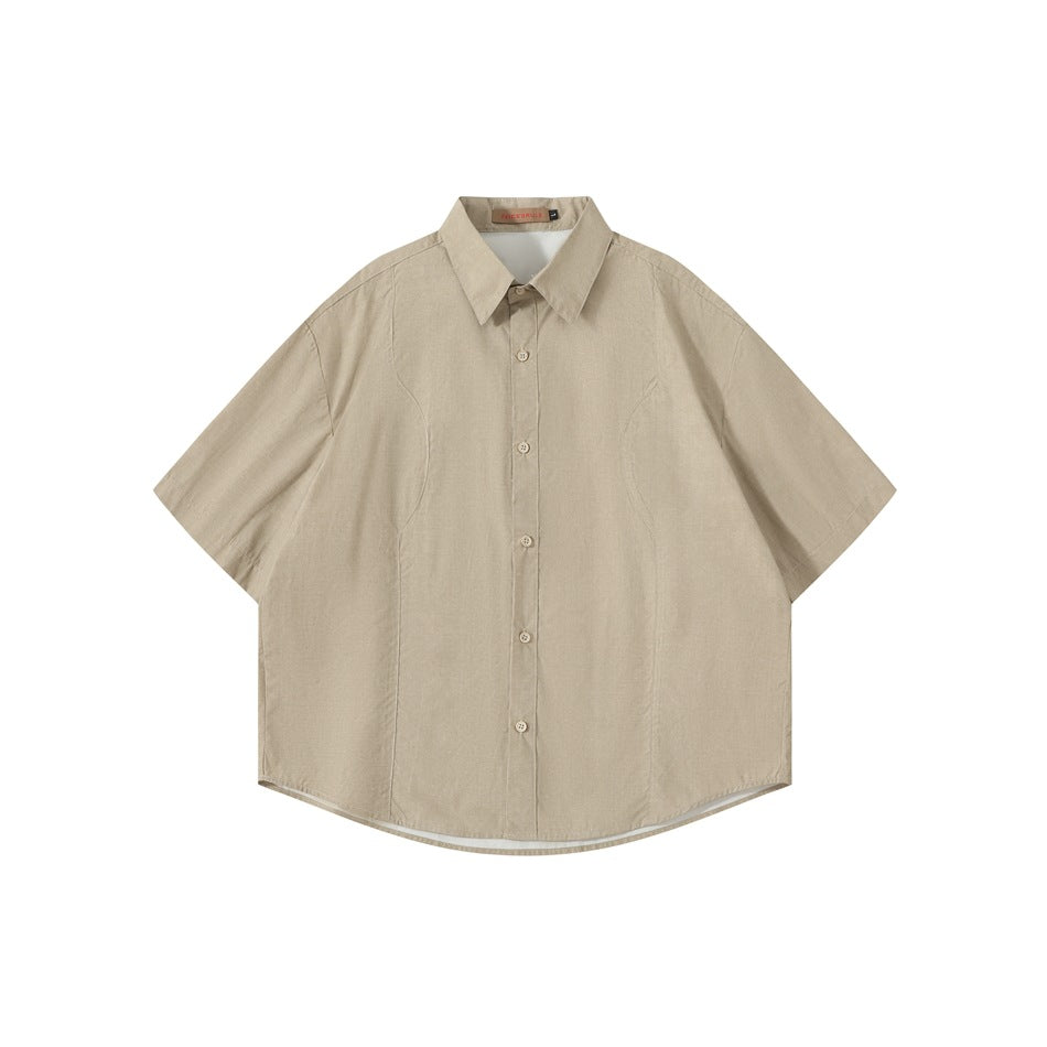 Khaki short-sleeve button-up shirt with pointed collar and curved front seams, shown flat from the front