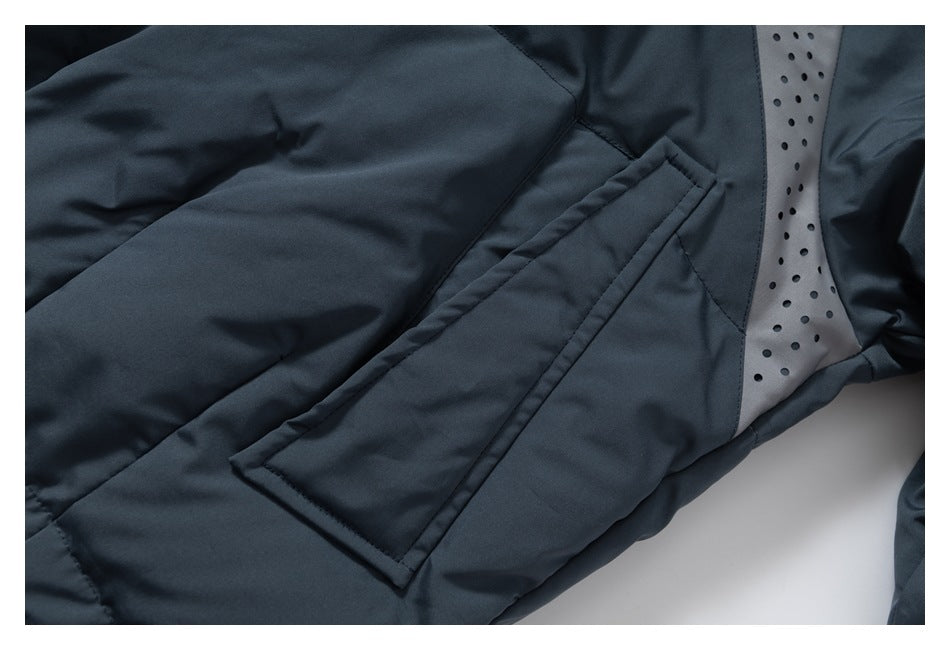 Close-up of a dark navy jacket pocket and gray perforated lining.