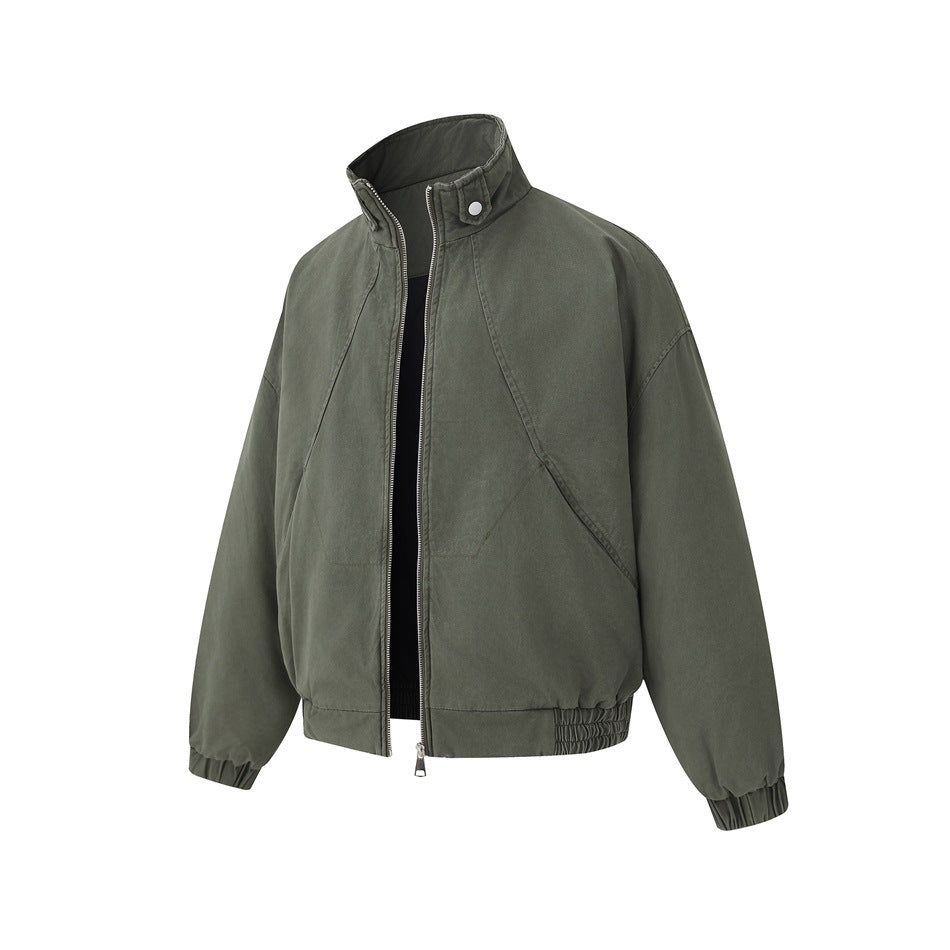 Front view of an olive-gray jacket with a stand collar, silver zipper, curved seams, and gathered cuffs and hem.