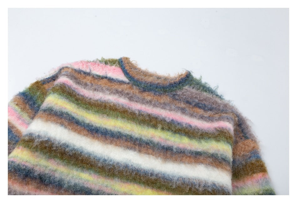 Close-up of the fuzzy multicolored striped sweater's neckline, shoulder, and long-pile surface.