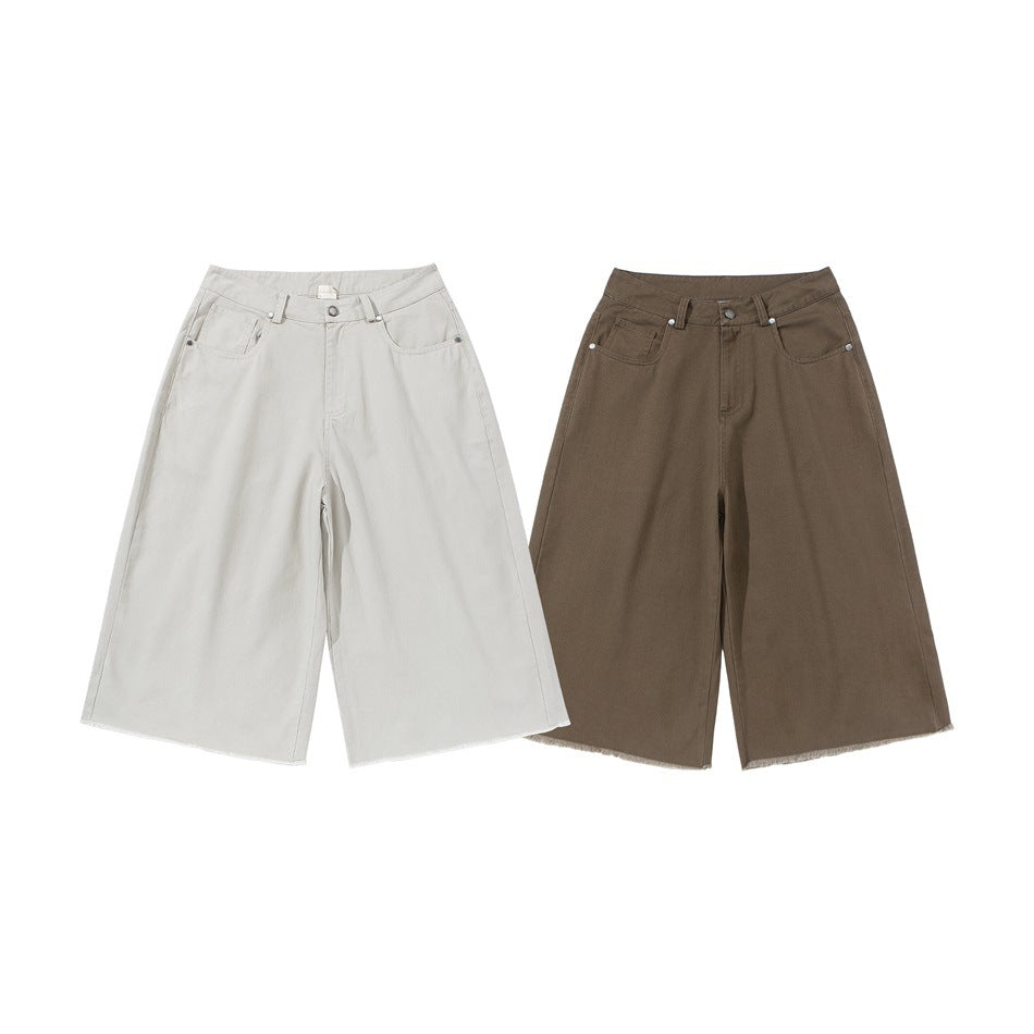 Front view of wide-leg shorts in light gray and brown, both with front pockets and frayed hems.