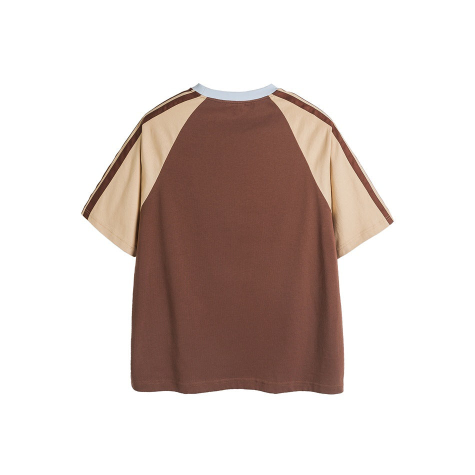 Back view of a brown raglan T-shirt with cream sleeves, brown shoulder stripes, and a pale blue crew neck.
