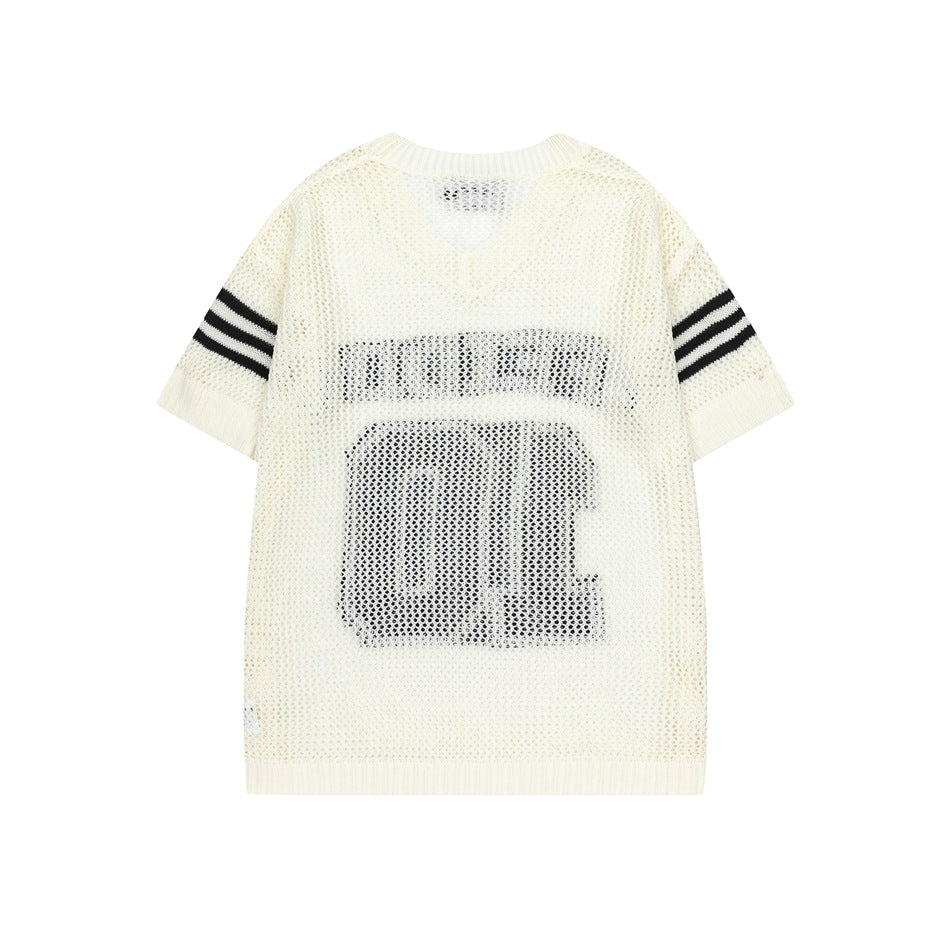 Back view of an ivory open-knit short-sleeve jersey with black sleeve stripes and a large dark number graphic.