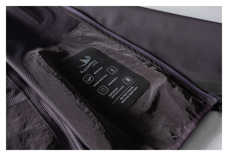 Interior jacket close-up showing a BLACKARMOR tag with English waterproof and water-resistant claims.
