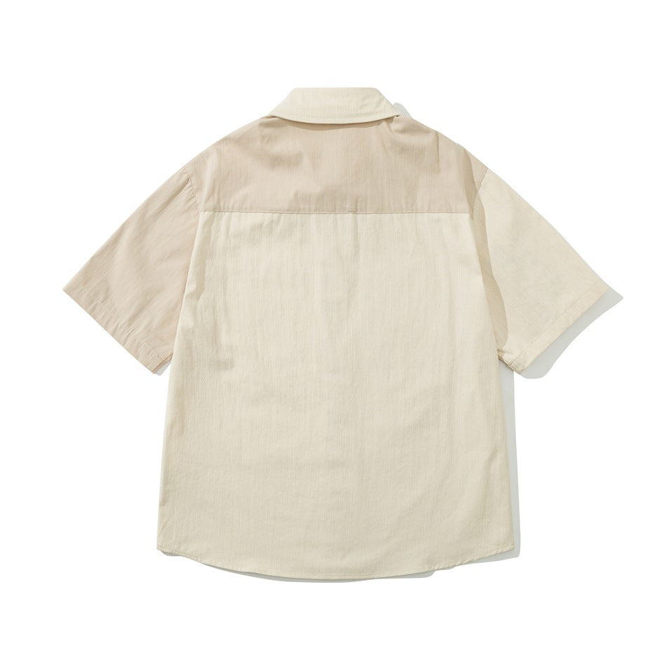 Back view of beige two-tone short-sleeve shirt with darker beige yoke and lighter cream lower back