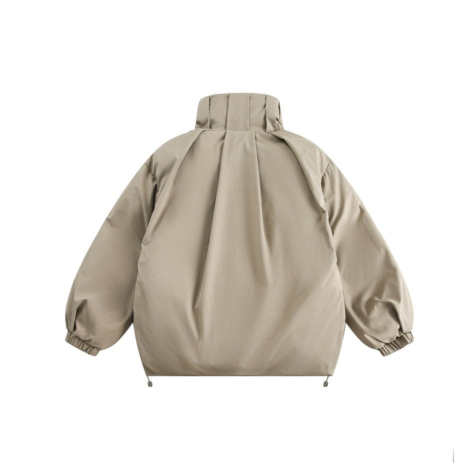 Back view of a light taupe jacket with a tall collar, roomy sleeves, elastic cuffs and adjustable hem cords.