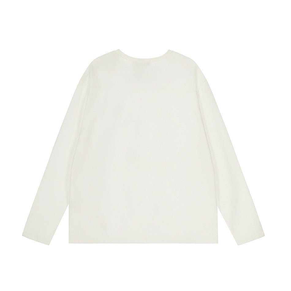White long-sleeve crew-neck top with a textured knit surface and a seam across the upper back, back flat view