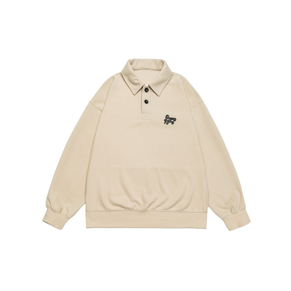 Beige long-sleeve polo-collar sweatshirt flat lay with two buttons and a small embroidered logo on the chest