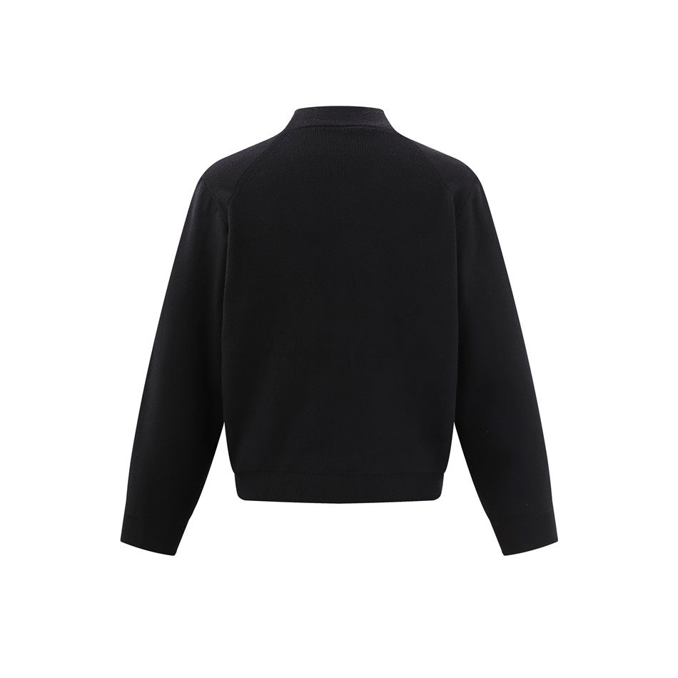 Back view of a black knit zip-up jacket with a stand collar, long sleeves, and ribbed cuffs and hem.