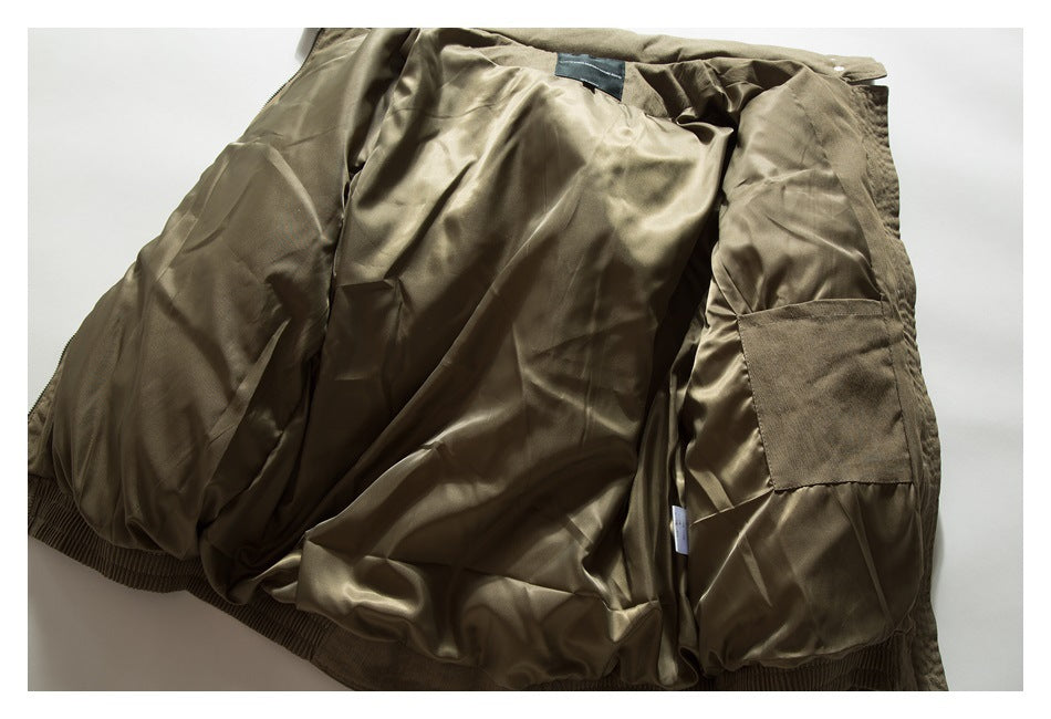 Olive-brown garment opened flat to show its shiny lining, interior patch pocket, and gathered edge.