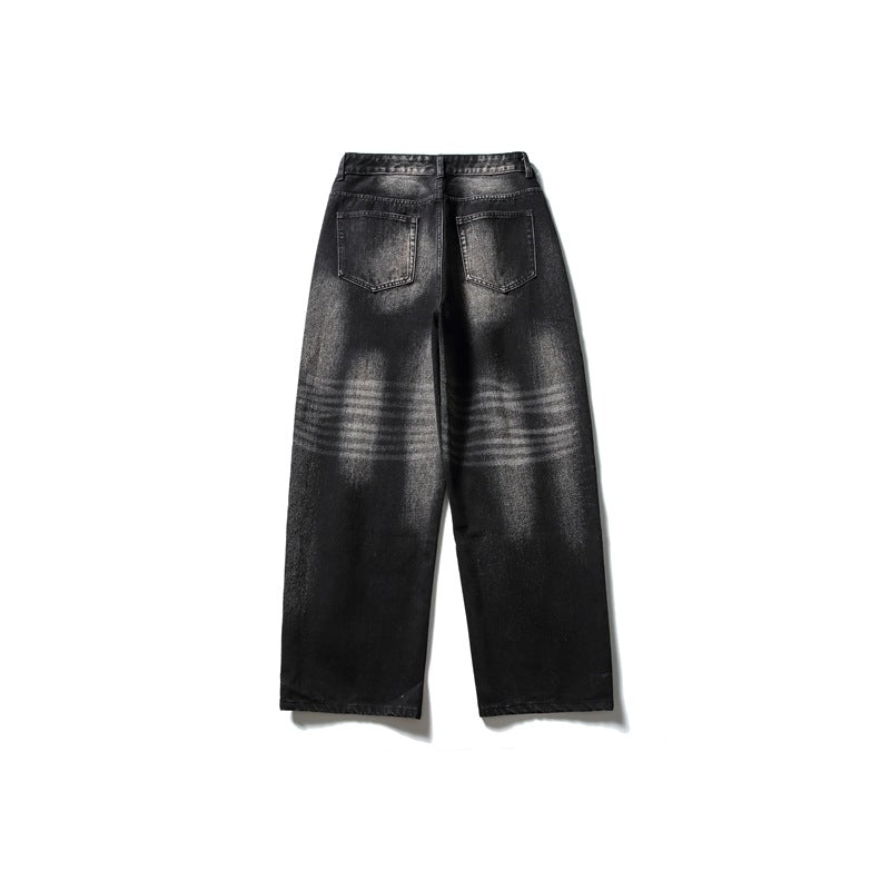 Faded black wide-leg jeans back view with two patch pockets and horizontal fade lines behind the knees