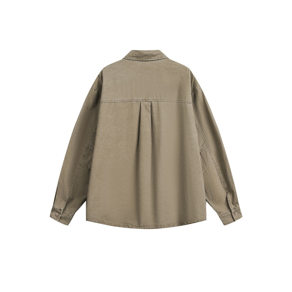Back view of khaki long-sleeve shirt showing yoke seam, center pleat and button cuffs, flat lay on white
