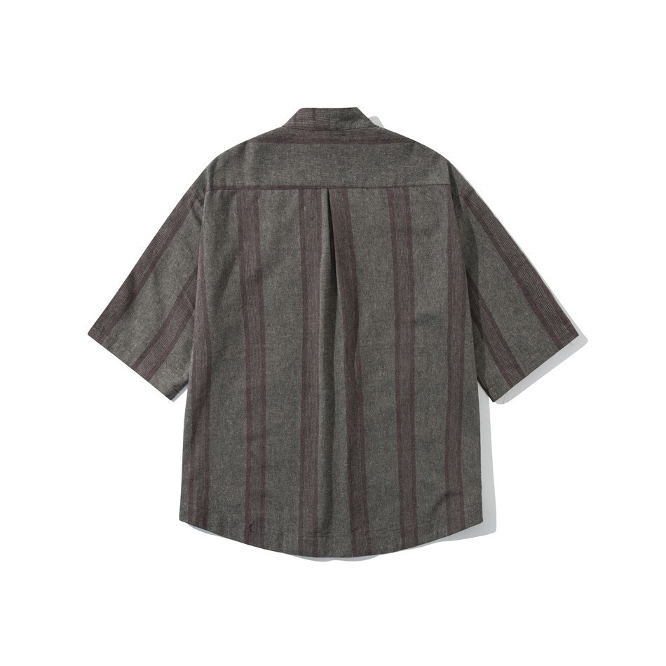 Back view of a brown-gray short-sleeve shirt with subtle vertical stripes and a center pleat.