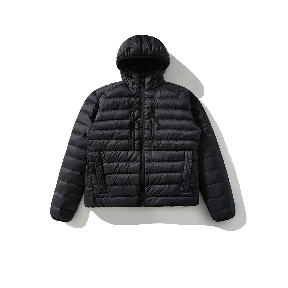 Black hooded quilted puffer jacket with front zipper and chest pockets, flat lay