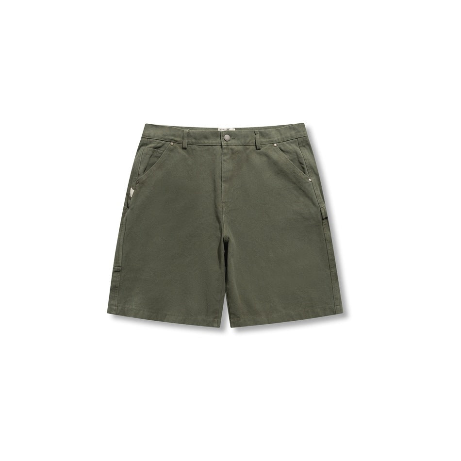 Front view of olive green canvas carpenter shorts with belt loops, button closure and rivet-trimmed pockets
