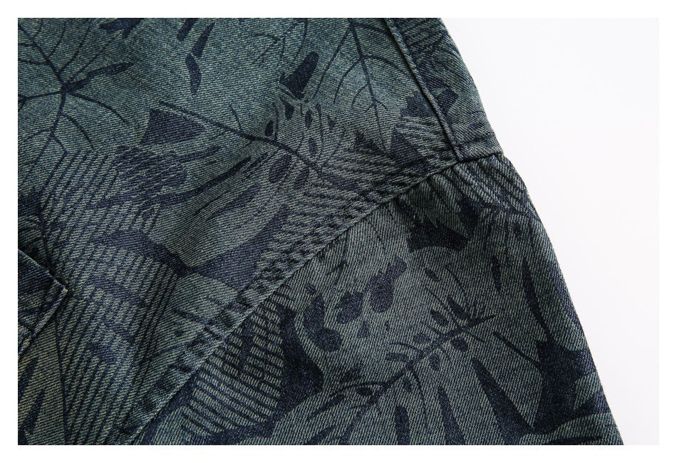 Close-up of the shirt's leaf print and stitched sleeve seam.