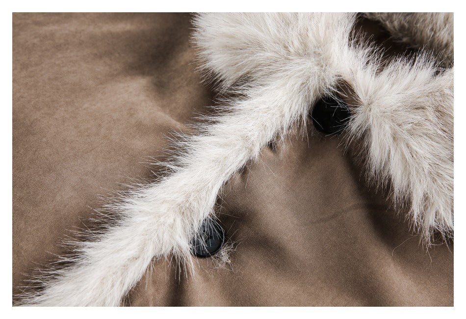 Close-up of cream fur edging and black buttons on the front of a taupe coat.