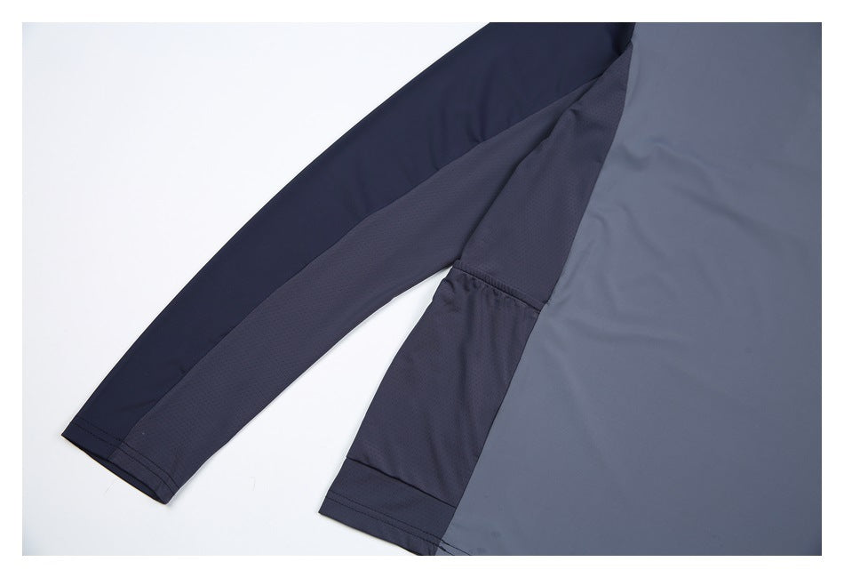 Close-up of the slate-gray top's dark contrasting sleeve and side panels.